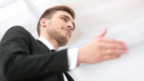 Male lawyer greeting clients