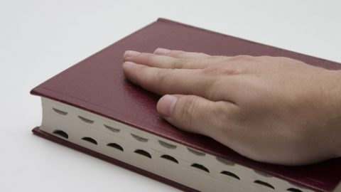 Hand on the Bible to testify