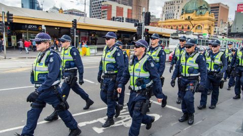 Australian police crossing the road