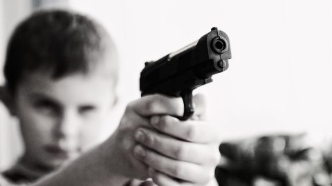 Boy with gun