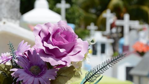 Funeral with purple flowers