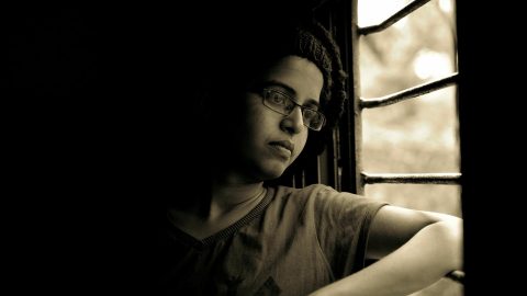 Boy looking out of window