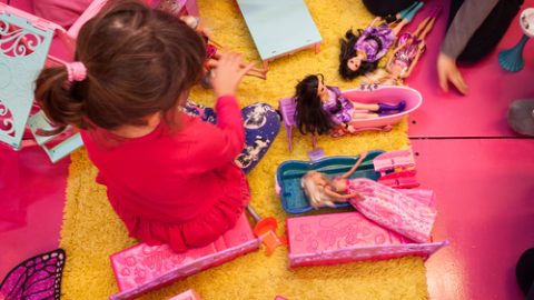 Young girl playing with toys