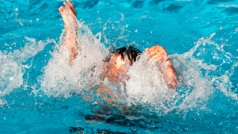 Boy drowning in a pool