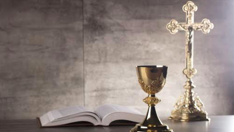 Catholic Church's bible, cross, and goblet