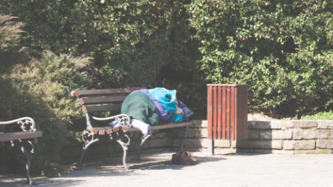 Homeless man on bench