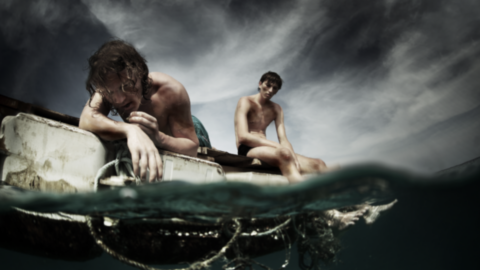 Men stranded on a boat