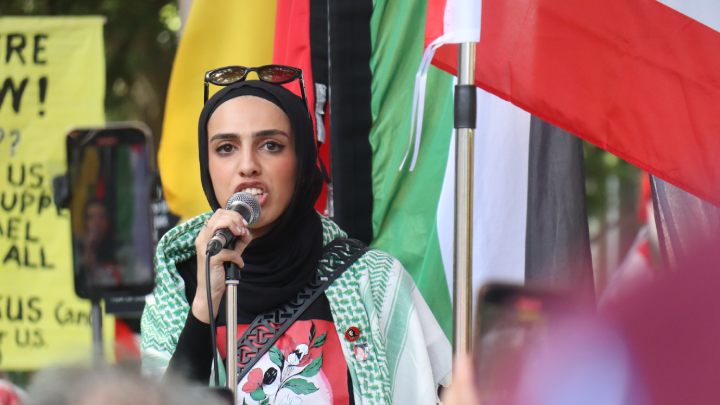 Amal Naser addressed the crowd. The Palestine Action Group member was key in ensuring that a NSW police attempt to shut down the yearlong anniversary march was foiled