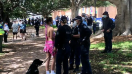 Police quizzing Field Day 2022 patron on New Year’s Day. Photo credit: Unharm employee Bruce Knobloch