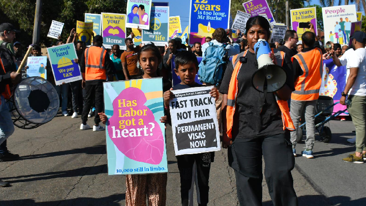 Tamil Refugee Council spokesperson Renuga Inpakumar and two young demonstrators