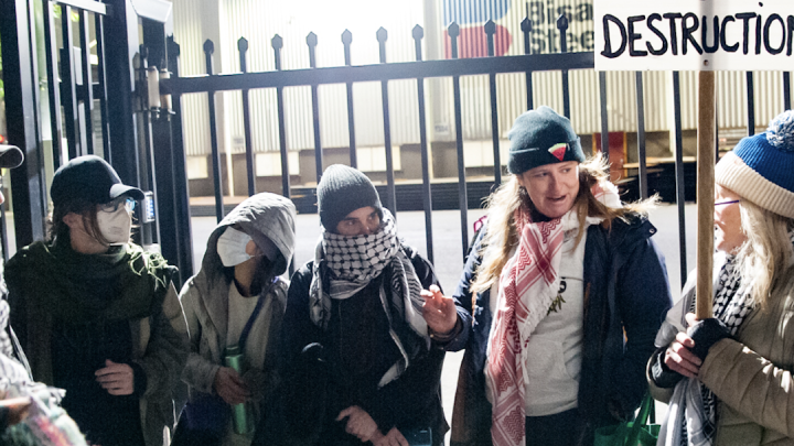 Wollongong Friends of Palestine organiser Jet Hunt (second from the right) speaking with other agitators at the 15 November Bisalloy Steel community picket in Unanderra