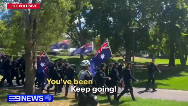 South Australian police officers pick off random neo-Nazis as a group of Nationalist Socialist Network members march through the Adelaide Parklands on 26 January